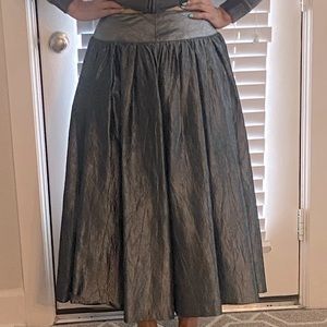 Full skirt. Silver color.